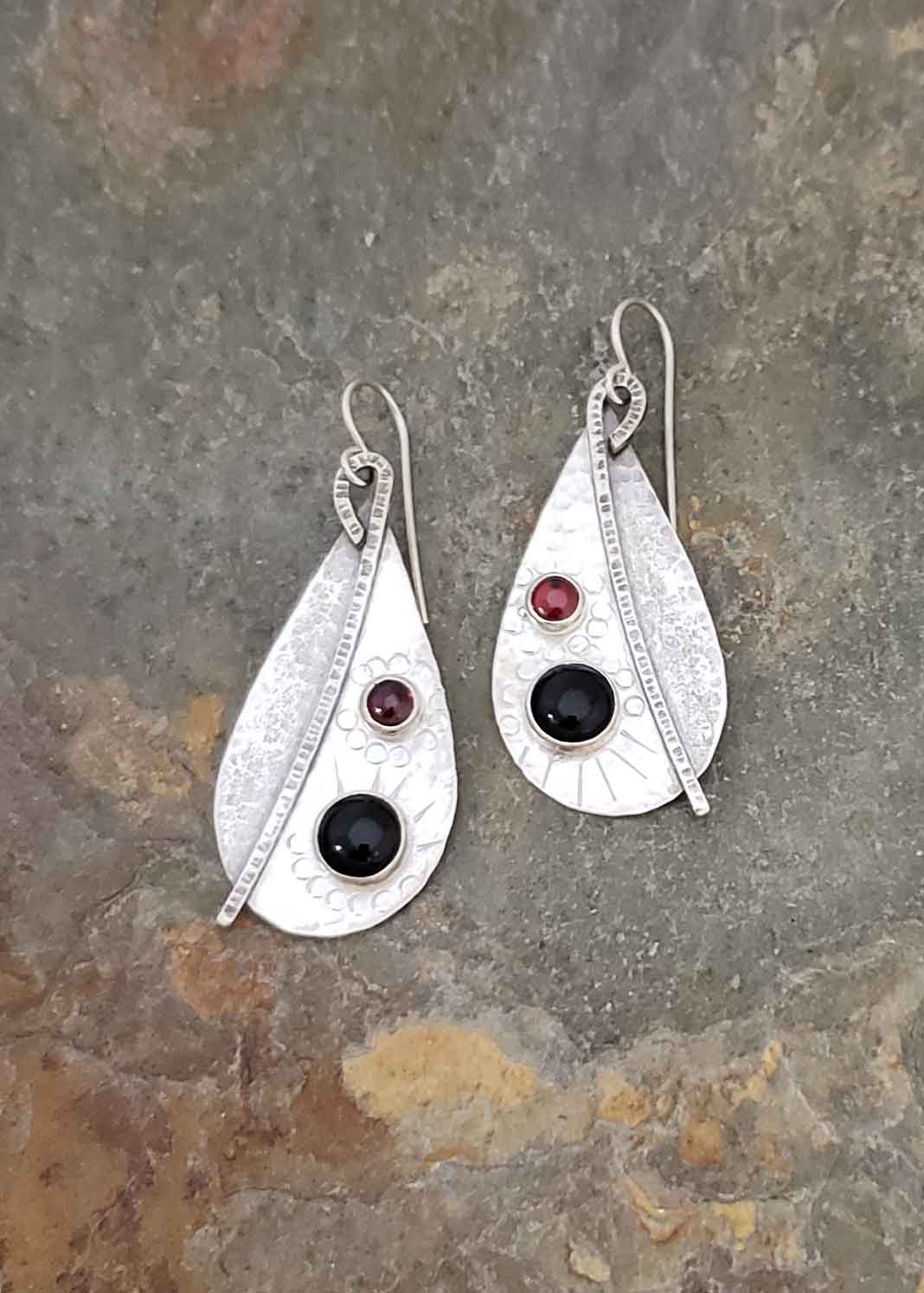 Silver earrings in red garnet and black onyx by Dona Miller.