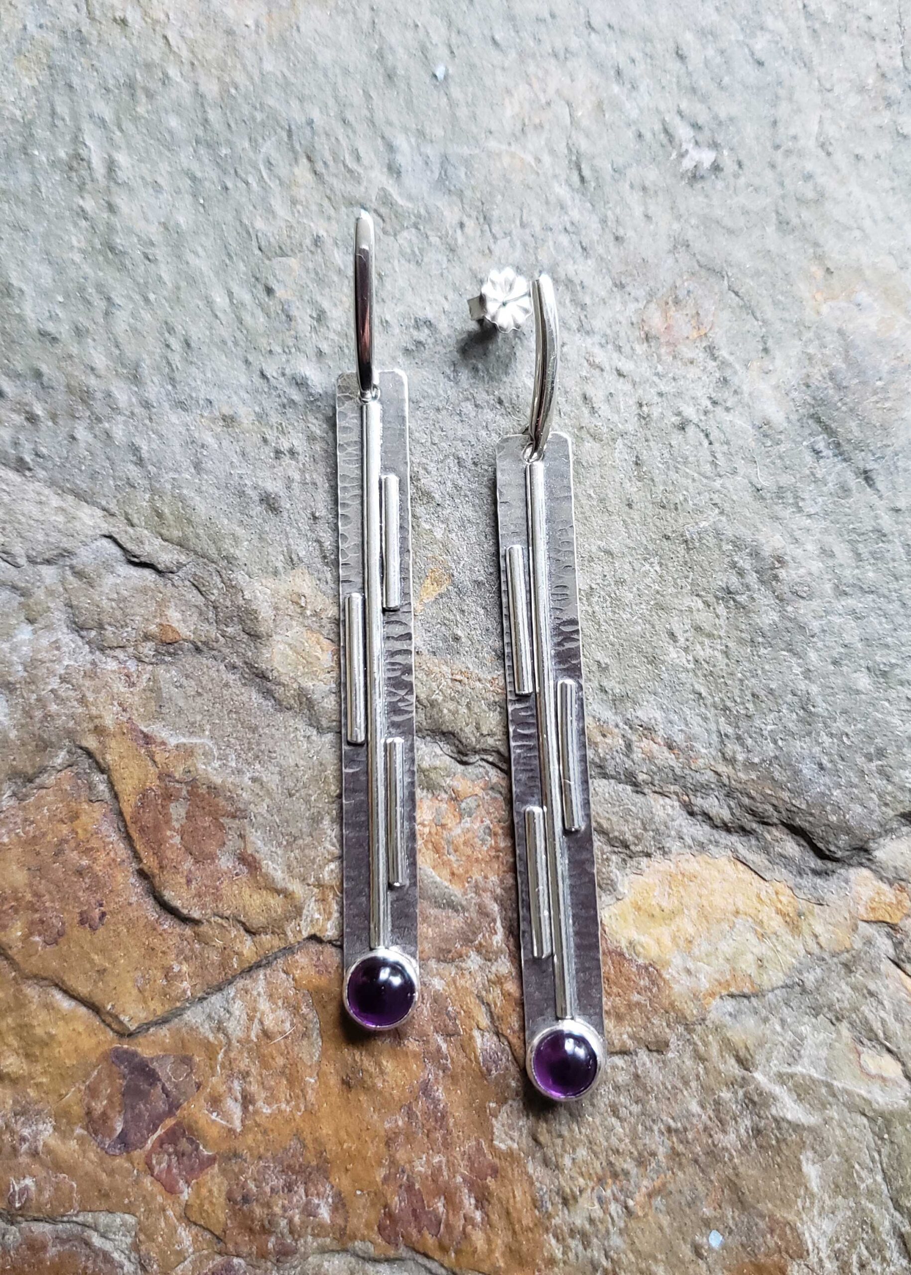 Long silver post earrings with purple amethyst, drawing the lines by Dona Miller.