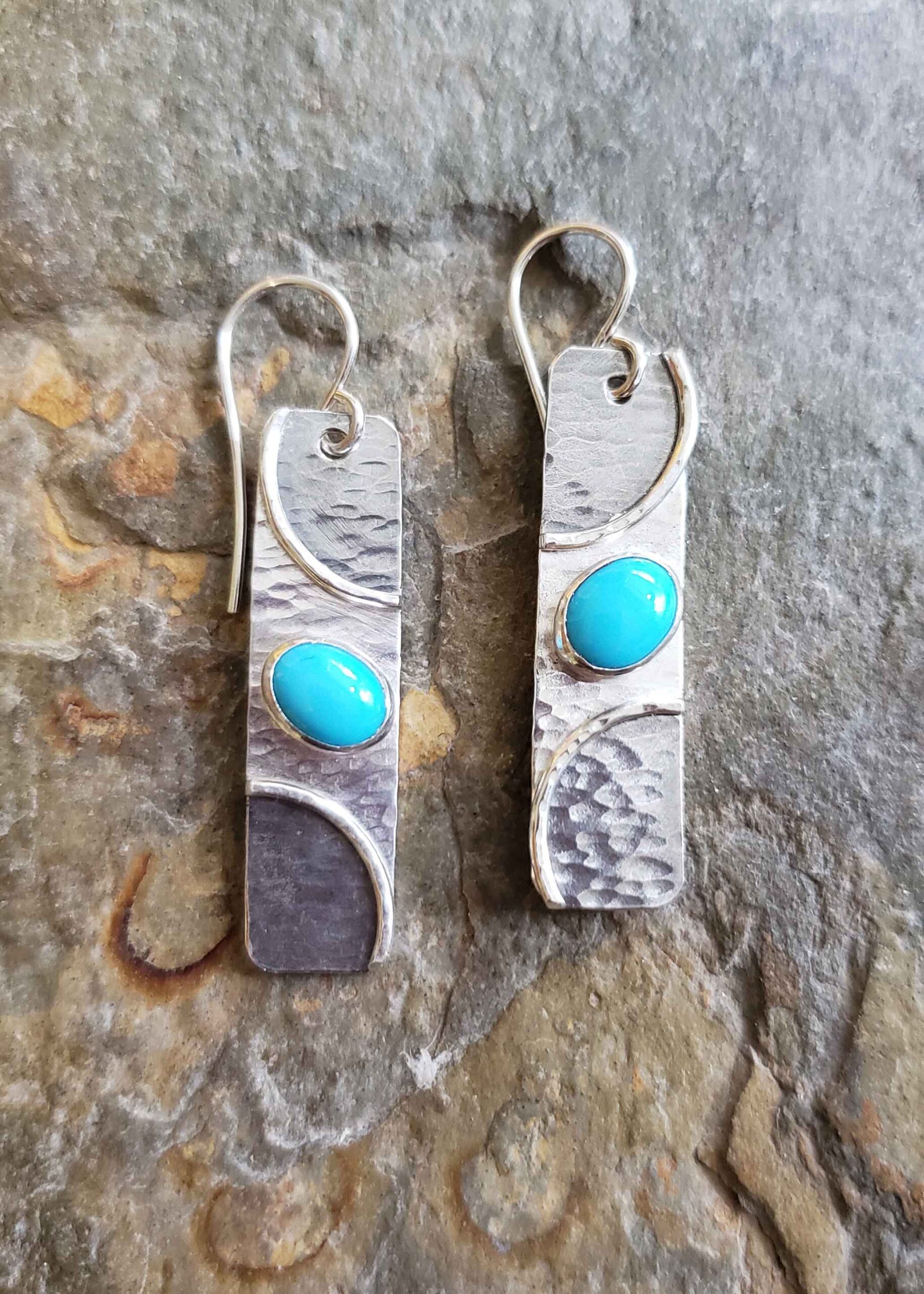 Silver and turquoise earrings by Dona Miller.