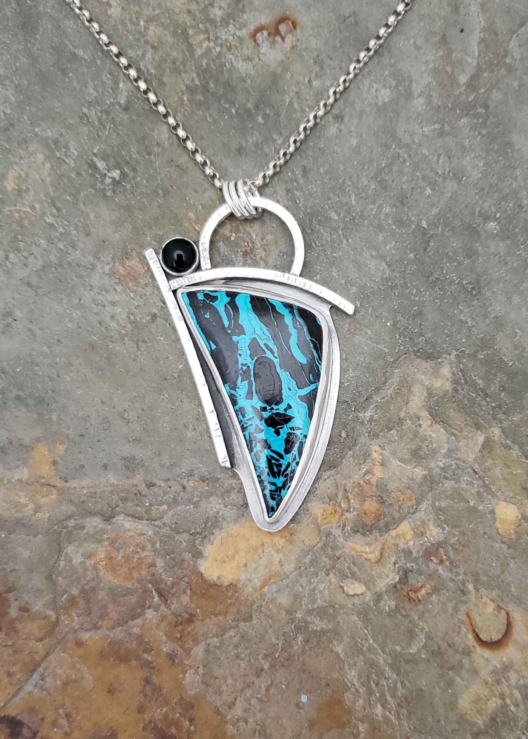 Dramatic blue and black silver pendant by Dona Miller.
