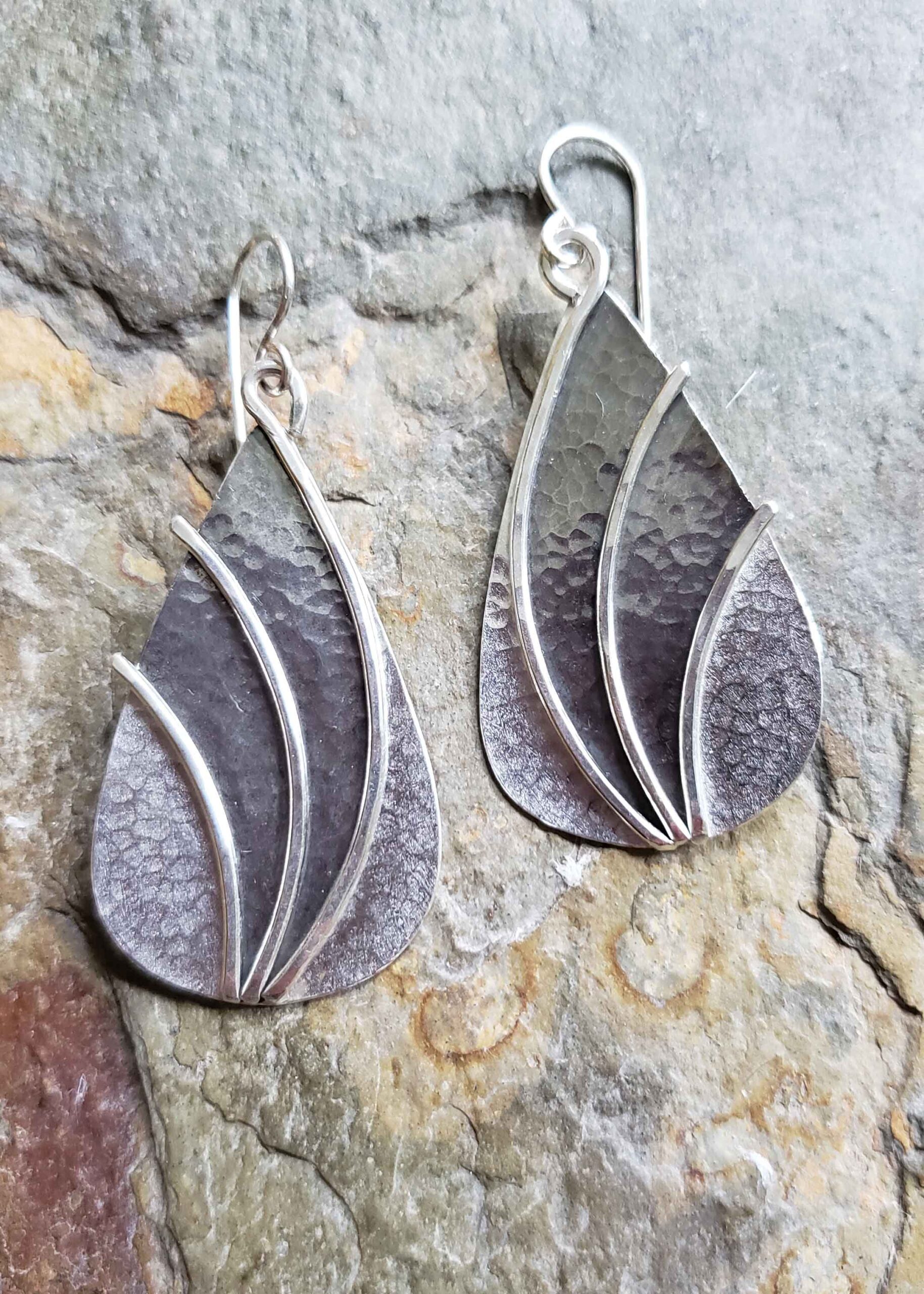 Large statement silver earrings by Dona Miller.