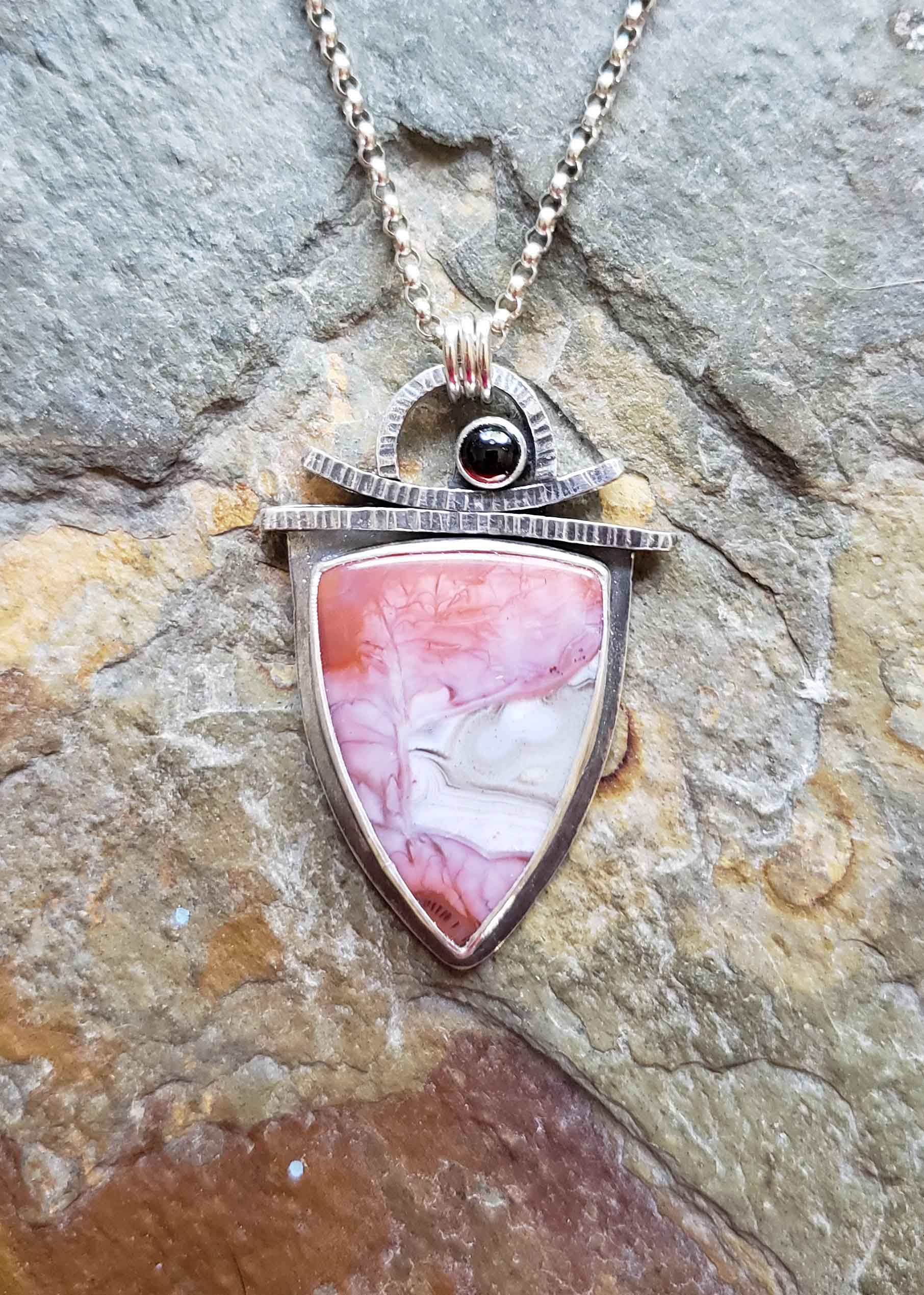 Reds, pinks and cream silver pendant by Dona Miller.