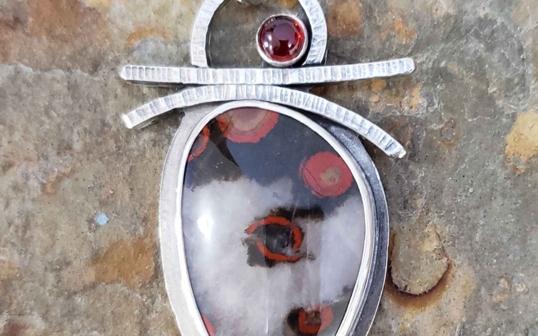 Red, black and white silver pendant by Dona Miller.
