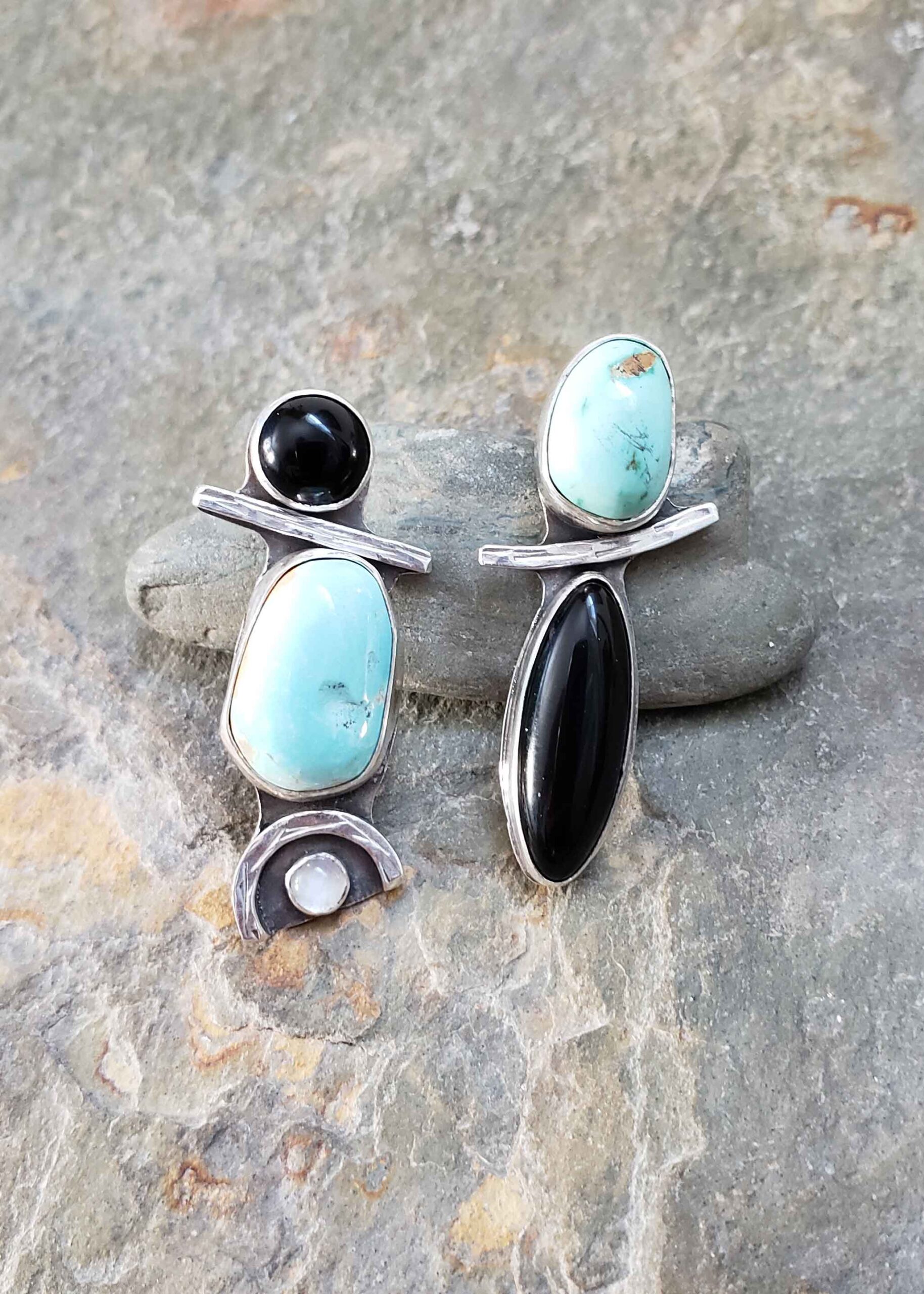 Turquoise, black and white silver asymmetrical post earrings by Dona Miller.