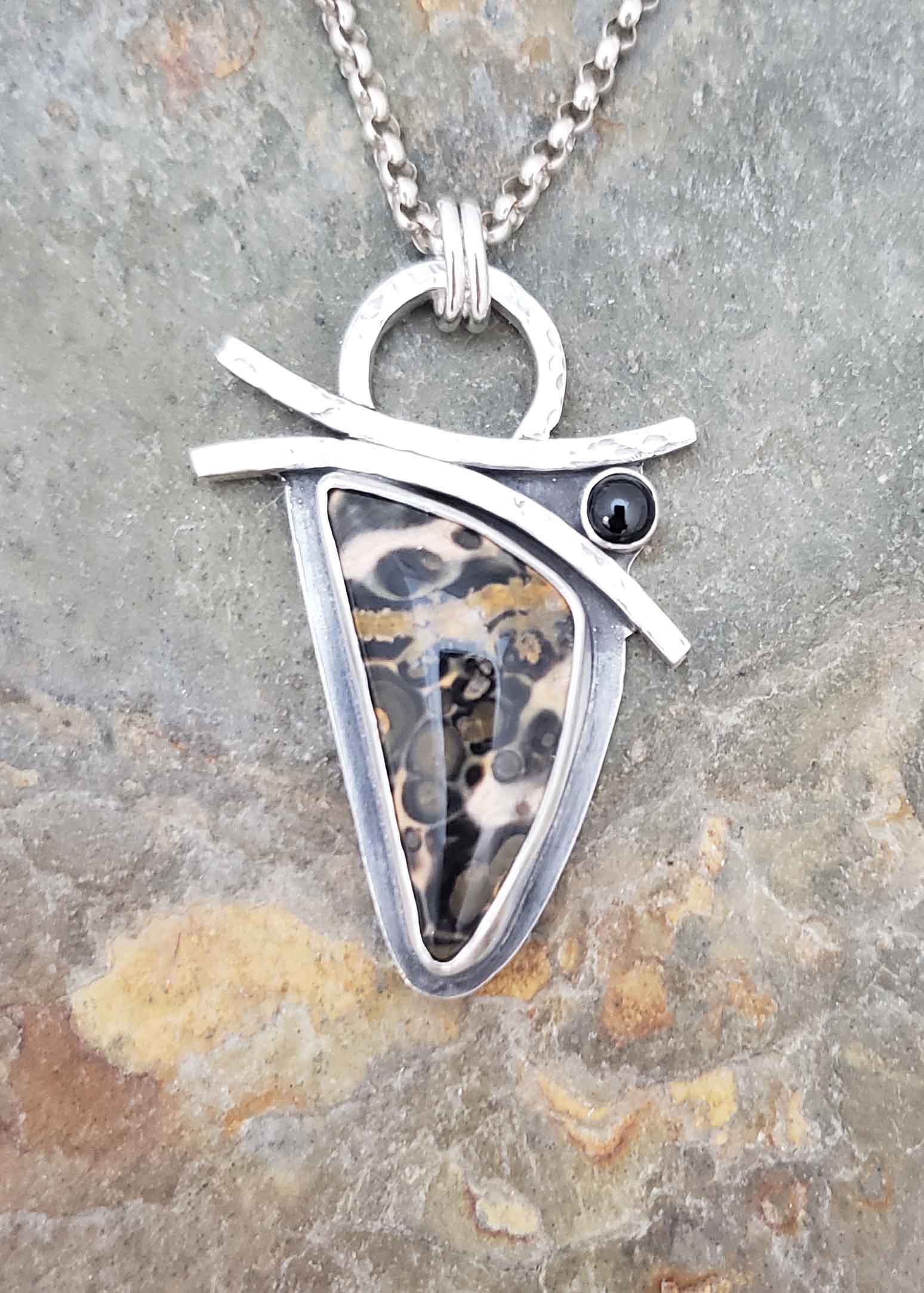 Emergence orbicular jasper and black spinel silver pendant.
