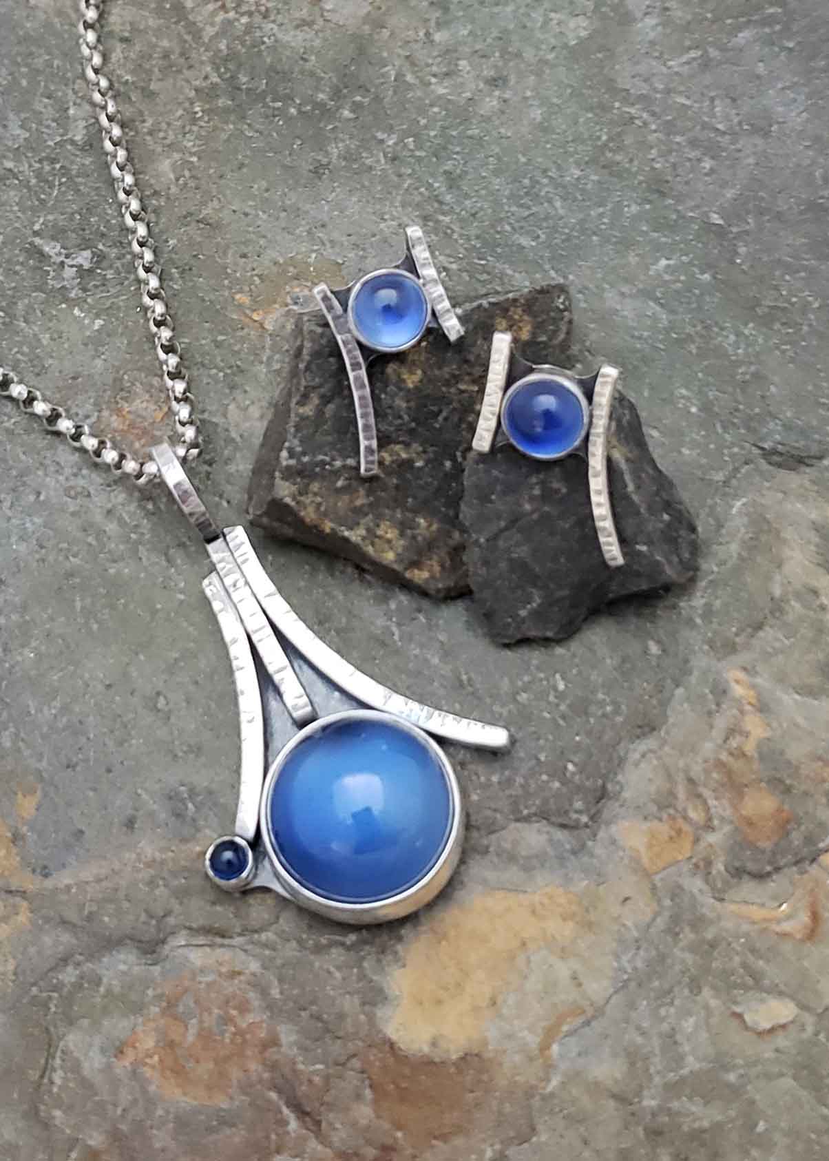 Glow - blue sapphires set over mother of pearl earrings and pendant
