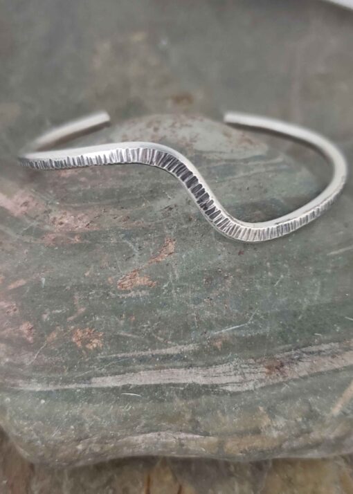 Z-wave silver cuff bracelet.