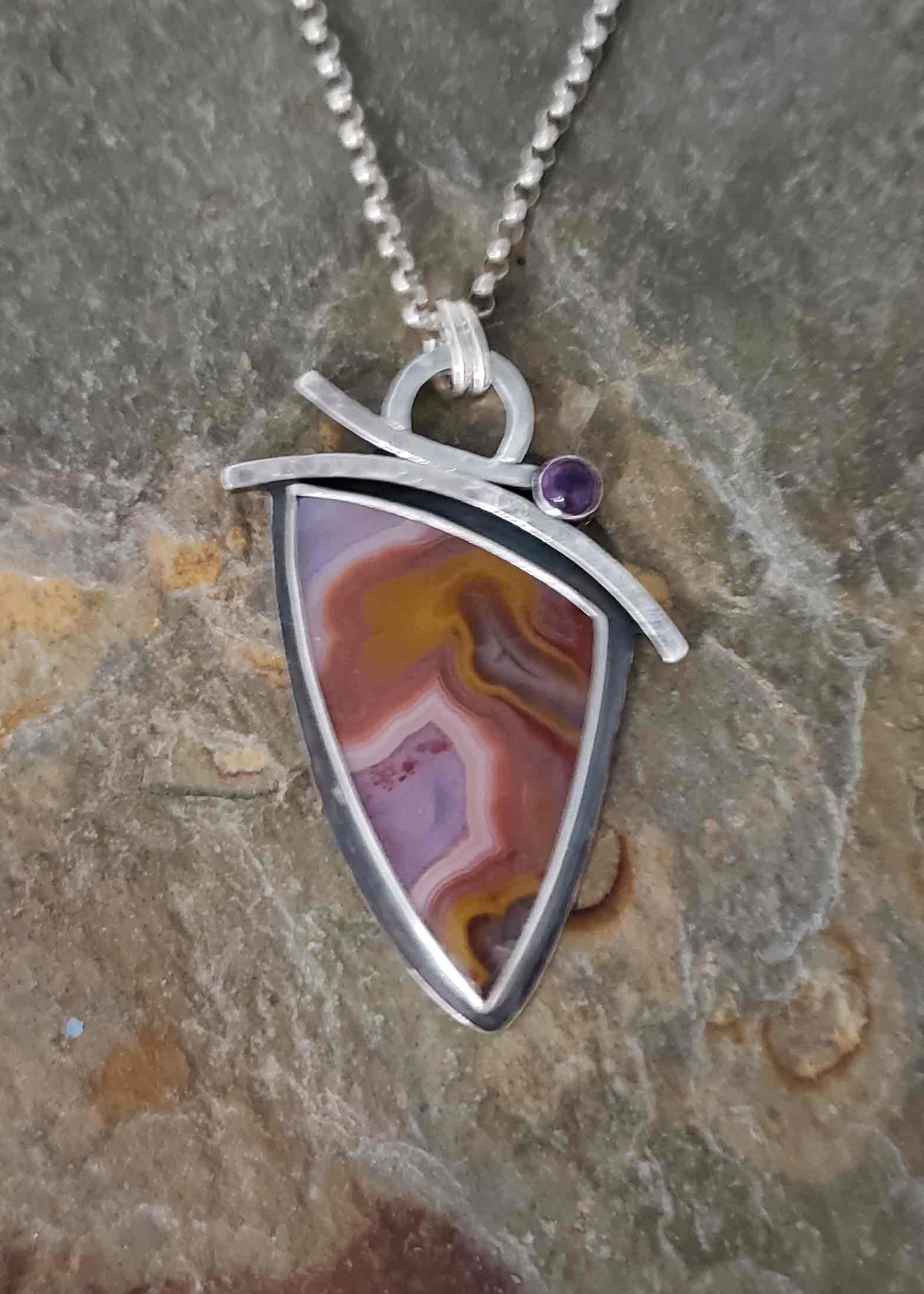 purples and rusts dominate this focal stone agua nueva, accented with amethyst