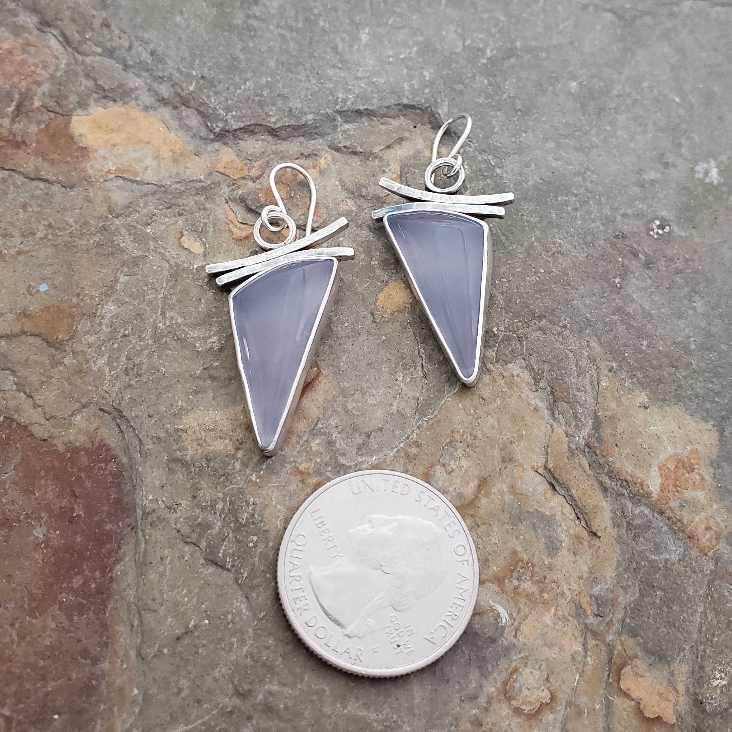 blue with a soft grey undertone in these silver earrings, by Dona Miller