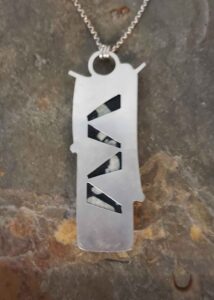 black and white contemporary silver pendant with chinese writing stone and moonstone