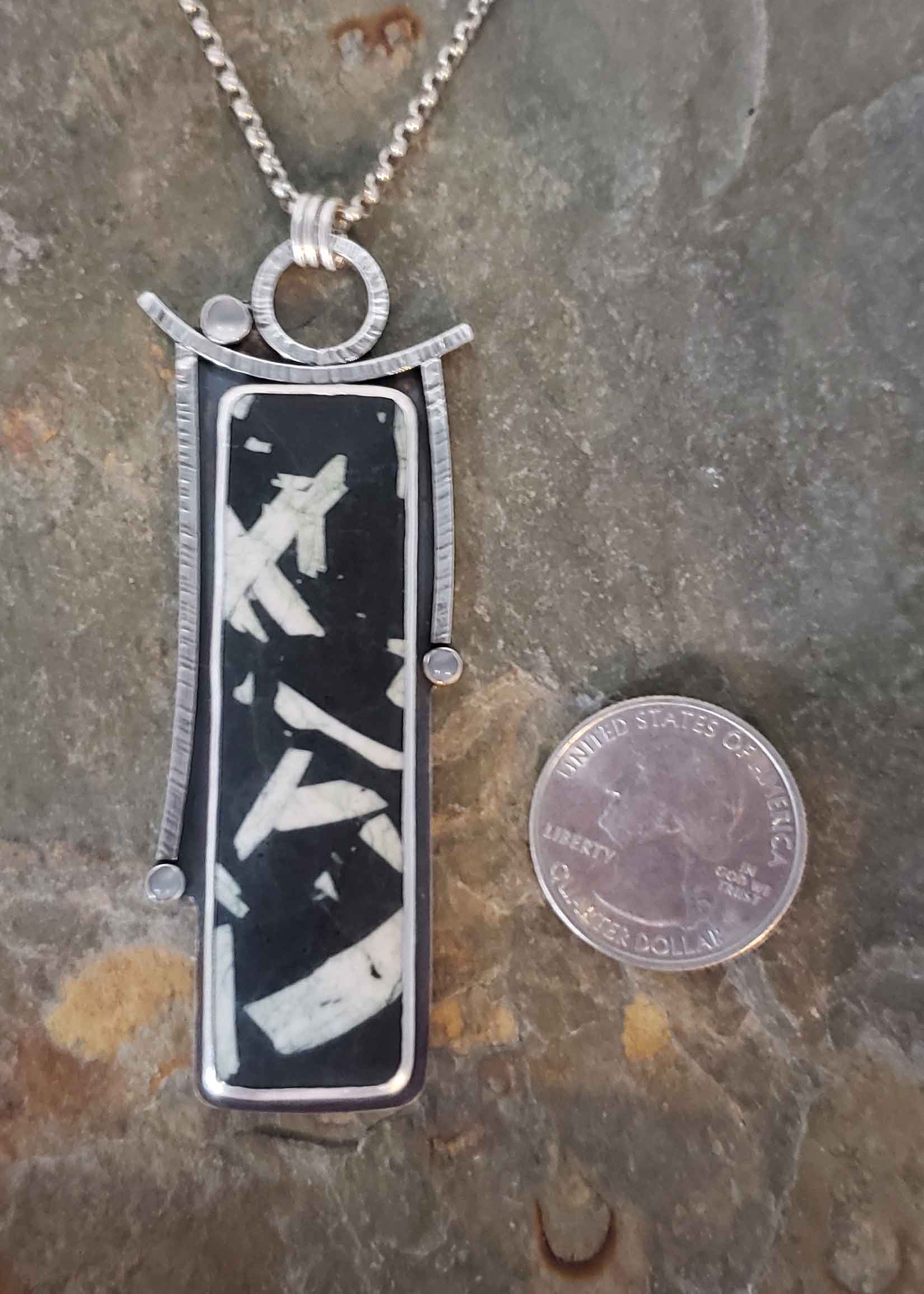 black and white contemporary silver pendant with chinese writing stone and moonstone