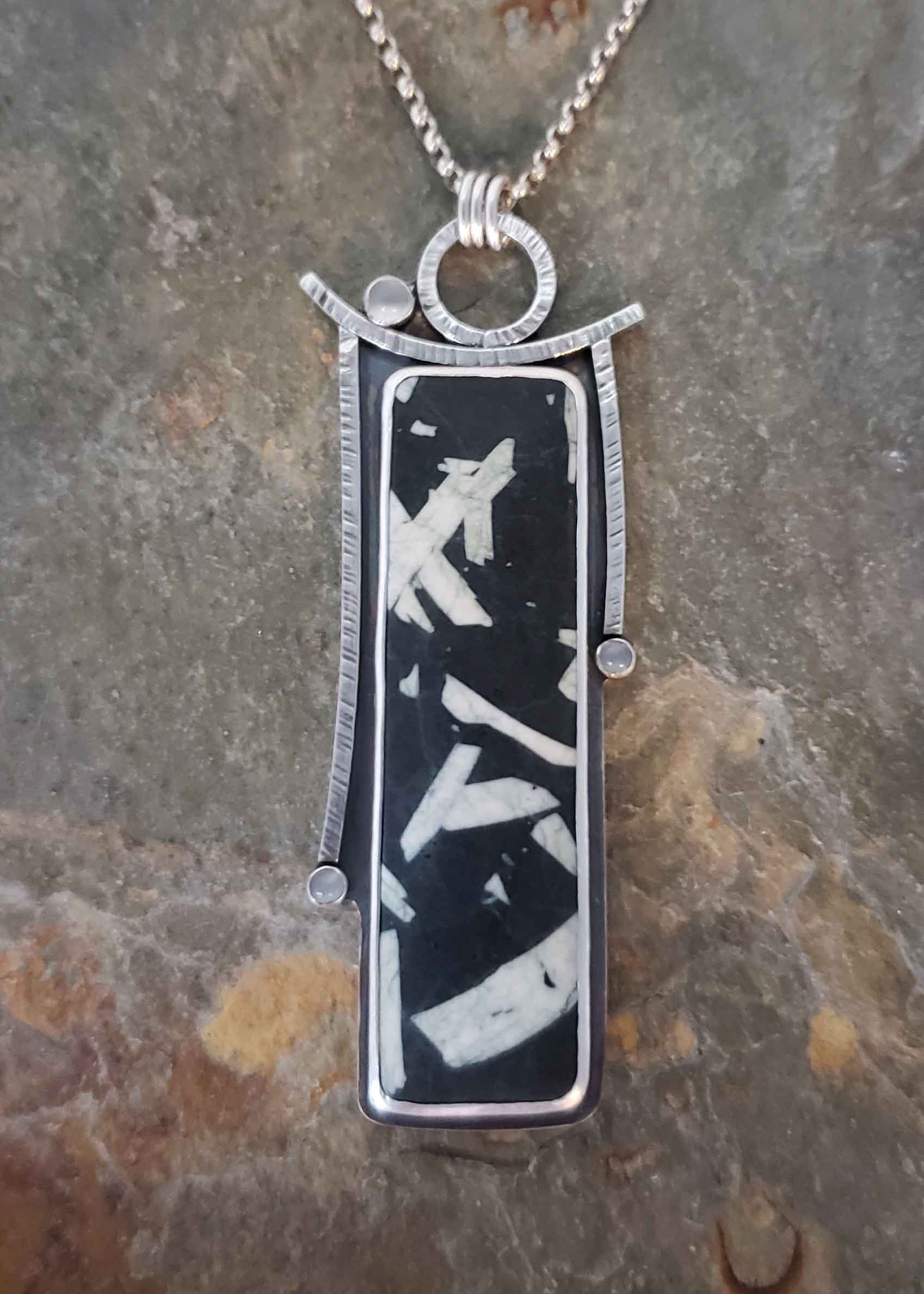 black and white contemporary silver pendant with chinese writing stone and moonstone