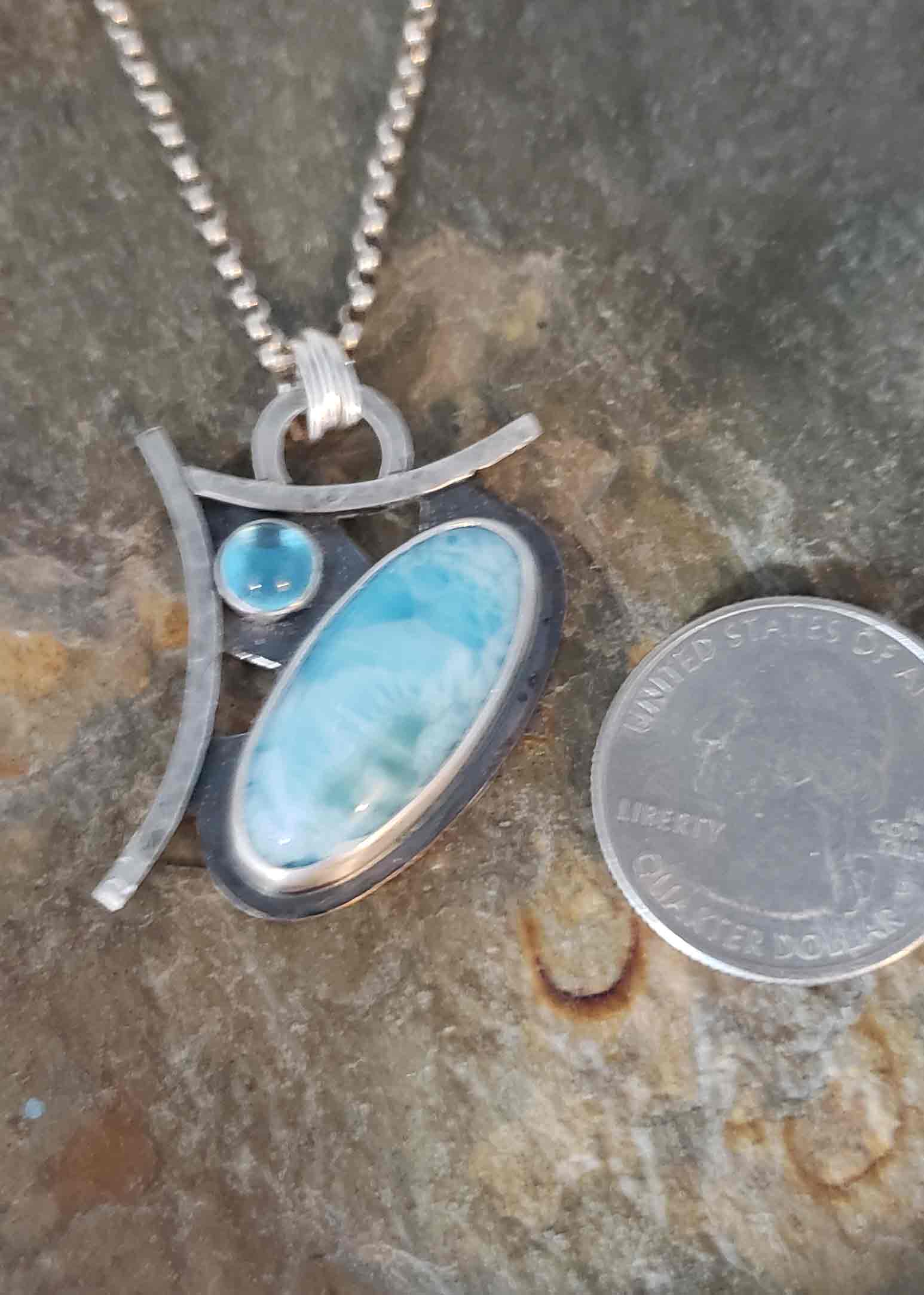 beautiful sky blues in this Larimar and Swiss Blue Topaz silver pendant.