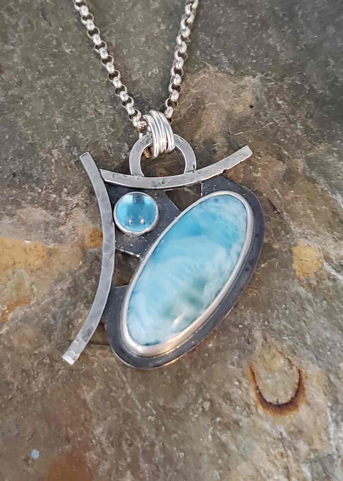 beautiful sky blues in this Larimar and Swiss Blue Topaz silver pendant.