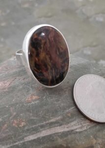 browns with glowing golden colors in this silver ring, by Dona Miller