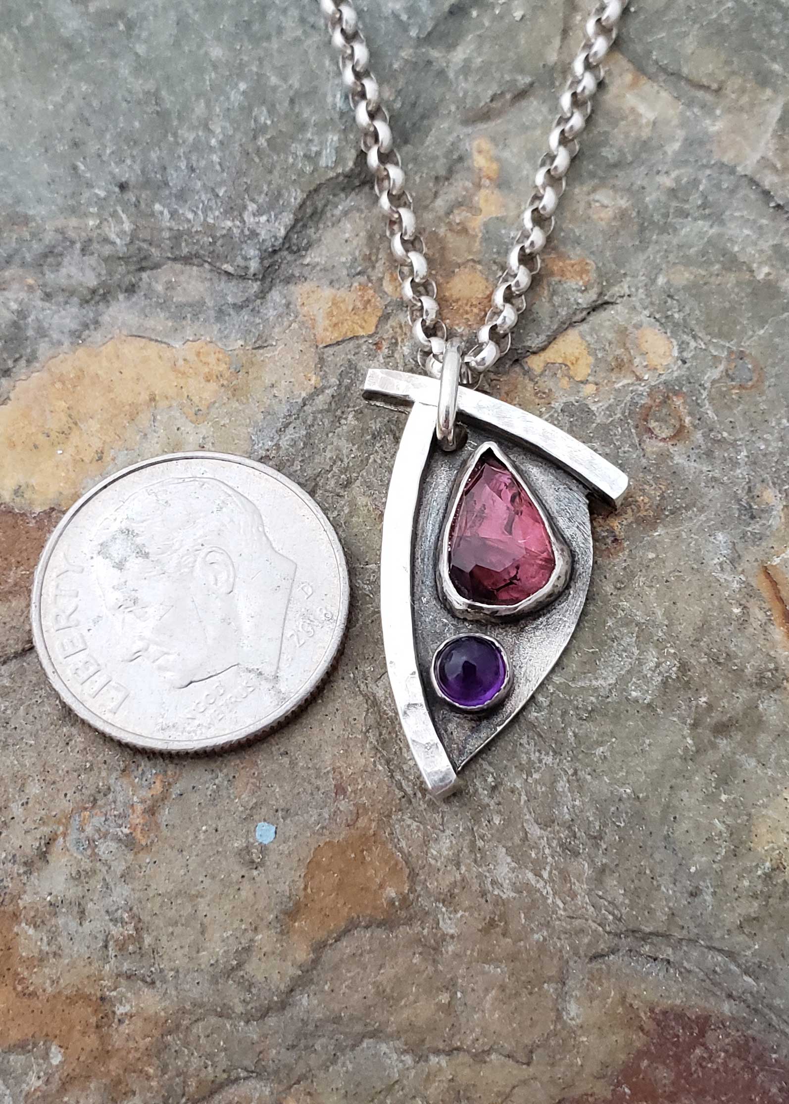 pinks and purples in this petite pendant, by Dona Miller