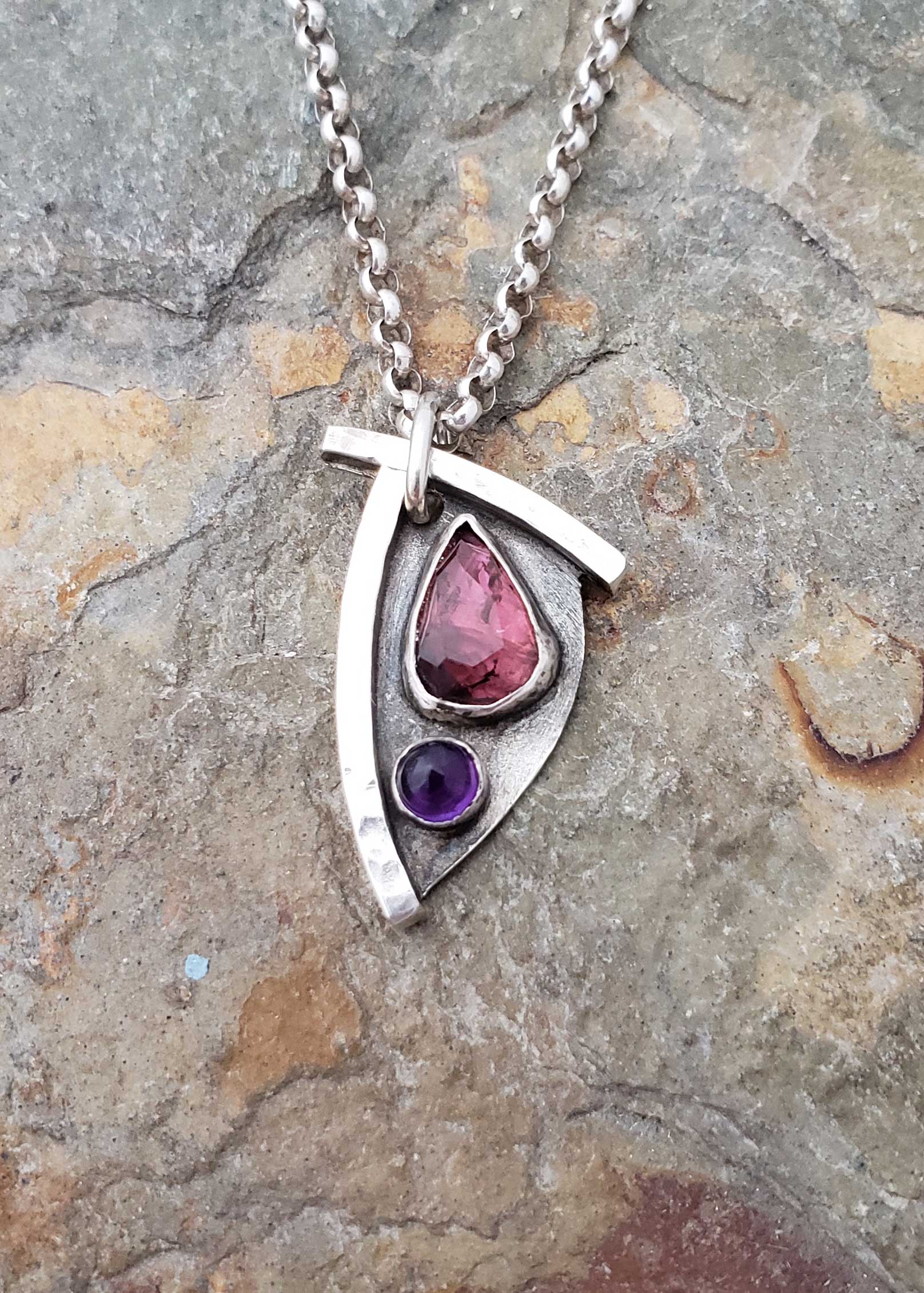 pinks and purples in this petite pendant, by Dona Miller 