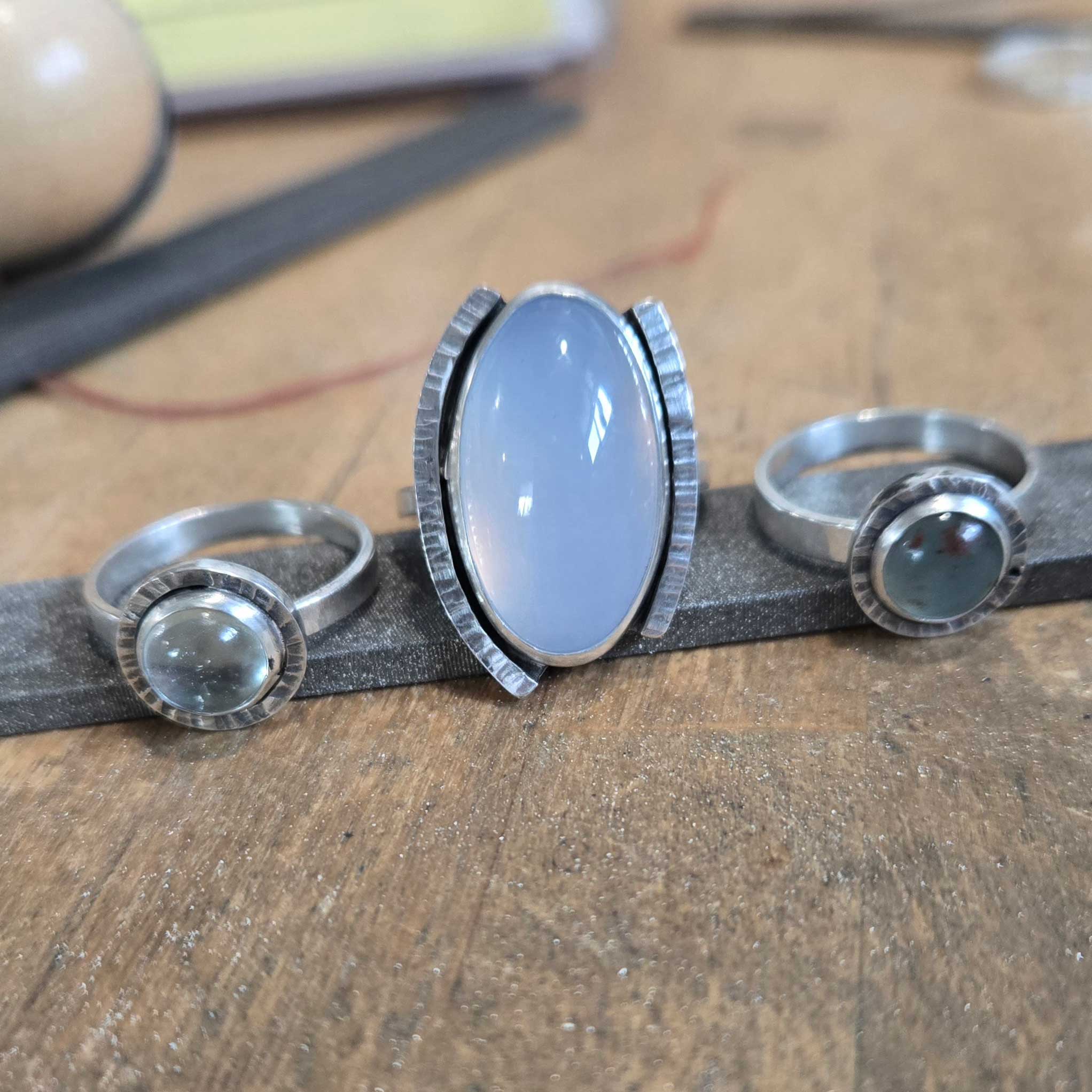 three silver rings with blues tones, aquamarine, chalcedony, aquaprase. by Dona Miller